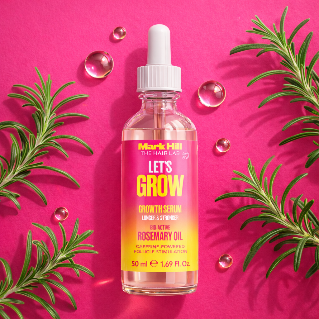 Bottle of Mark Hill The Hair Lab growth serum with rosemary leaves on a pink background