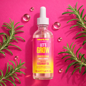 Bottle of Mark Hill The Hair Lab growth serum with rosemary leaves on a pink background