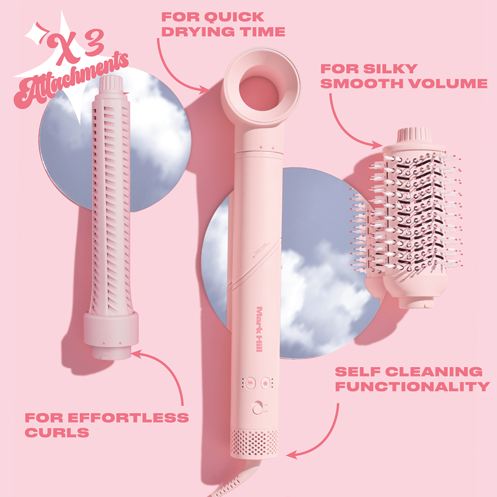 Hair dryer with attachments on a pink background