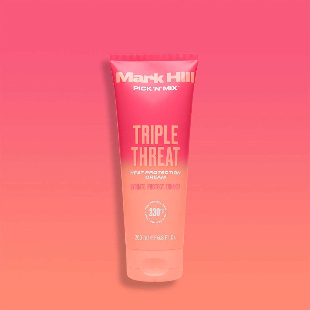 A tube of Mark Hill Triple Threat Heat Protection Leave In Cream against a pink gradient background.