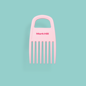 A pink curl comb with wide teeth, designed for brushes and combs, with the brand name 'Mark Hill' on the top.